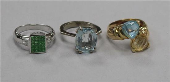 Three 18ct gold and gem set dress rings, including a white gold, green garnet? and diamond tablet ring.